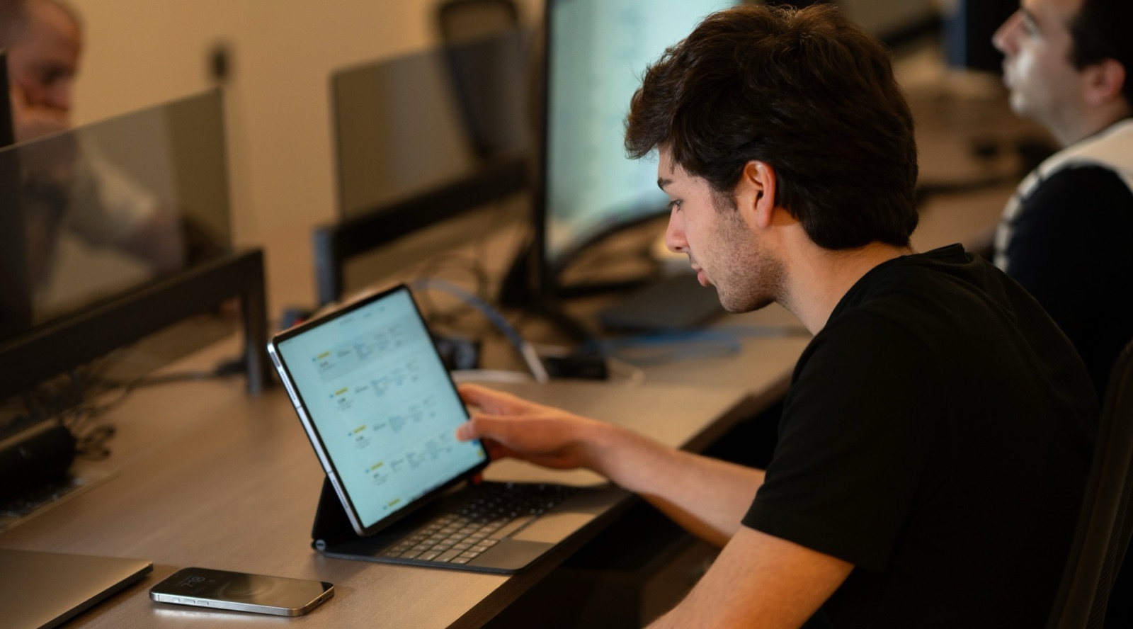 Student exploring a load board on tablet